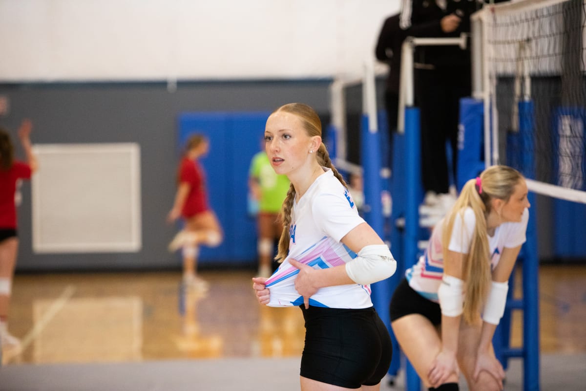 Adi focused near the net with her teammates